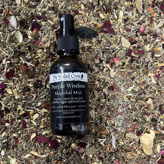 Purple Wisdom Mist on a bed of dried herbs and flowers.